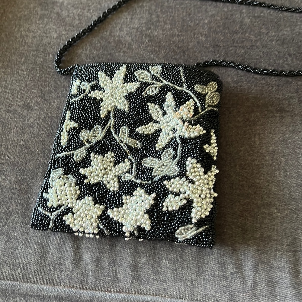 Very cute and tiny beaded purse.